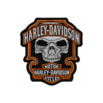 Harley-Davidson skull embroidered patch with gray skull, black shield background, orange outlines and bold stitched lettering