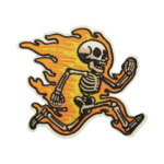 Skeleton riding through flames embroidered patch with orange fire, skull design, black outline and custom cut border